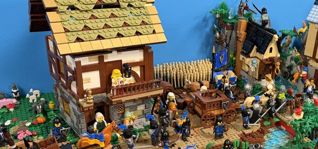 A LEGO castle village MOC on display at a Brick Cities show