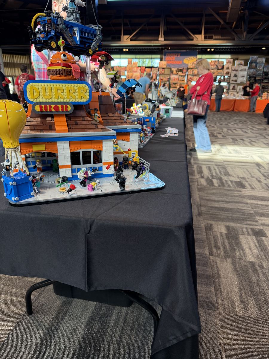 A brick-built diner scene full of minifigures on the Milwaukee show floor